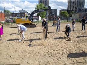 Mayor Ed Holder, centre, was joined by others in a groundbreaking ceremony at the former site of the Embassy Hotel on Dundas Street in London on Wednesday. It will be the site of the Embassy Commons, a 72-unit apartment building that will offer supportive housing. (Derek Ruttan/The London Free Press)