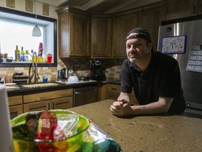 Instead of being in the kitchen of his London home, Colin Egan would rather be using his chef training at a restaurant. But he was laid off during the COVID-19 pandemic, and restaurant jobs are hard to come by. Mike Hensen/The London Free Press/Postmedia Network