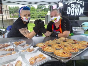 Jude Anderson-Clutz of The Welsh Baker and Lynn Lavois, of the Gen3 baking team put their desserts to the test. Anderson-Clutz puts her Italian Bomboloni against Lavois' fruit pies at the Bake Sale Showdown, filmed Friday, Aug. 28 in Springbank Park. The bake sale is Saturday morning, with the winner of the reality TV series being the team that sells the most baked goods for charity. (Mike Hensen/The London Free Press)