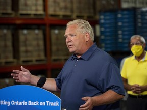 Ontario Premier Doug Ford makes an announcement with Vic Fedeli, Minister of Economic Development, Job Creation and Trade at Clean Works Corp. in Beamsville, Ont., on Tuesday, August 4, 2020. THE CANADIAN PRESS/Tara Walton
