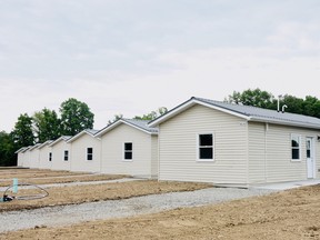 Eight new 'tiny homes' have been completed on Six Nations and were toured Friday at an official ribbon-cutting event.