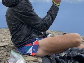 Dr. Andy Reed keeping well hydrated on Roche Bonhomme summit, Jasper. Courtesy of Martine Grenon-Lafontaine