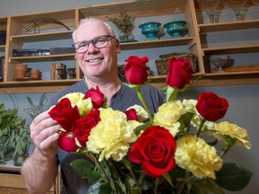 Ralph Dekker, owner and floral designer with Blue Lakes Floral Design, prepares floral arrangements for weddings and events. photo by Pam Doyle/www.pamdoylephoto.com