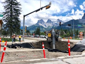 The Bow Valley Trails intersection construction is on schedule according to the Town of Canmore. Manager of Engineering with the Town, Andy Esarte, said the project is scheduled for construction to continue into November and landscaping to be completed next spring. "This is a very challenging project as it is a full rebuild of deep utilities, traffic signals and surface works in our largest and busiest intersection. Deep utility work took six weeks longer than scheduled due to a very high ground water season, and a few unknown subsurface conditions that held things up.  We will make up the majority of that time with good weather this fall; however if the weather doesn't hold we could see some additional work move into 2021," said Esarte.  Overall contract completion remains July 1st, 2021. (Pictured) Deep utility construction underway on July 2. Photo Marie Conboy.