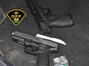 Two men have been charged after an incident in Trenton early Sunday which included OPP officers seizing two loaded handguns from a vehicle officers attempted to stop on Highway 401.
OPP PHOTO