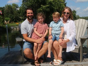 Pictured is the Verner family at their Roblin Lake home. They include, Jordane with daughter Mailin and Jillian with son Edden. Jillian was diagnosed with Stage 3C colorectal cancer a year ago and is on her way to making a full recovery. Her husband Jordane and four other riders will take part in Jillians Road on Sept. 6, riding to Belleville and Kingston to raise funds for cancer clinics. BRUCE BELL