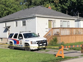 Police remained on scene throughout the weekend at a residence on Burnham Street in the city's east end where it is believed a 45-year-old city woman was murdered. BRUCE BELL