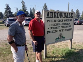 Golfers Bernie Fenton (left) and Tony DeBruyn say they are disappointed that Arrowdale Municipal Golf Course will be sold. Vincent Ball