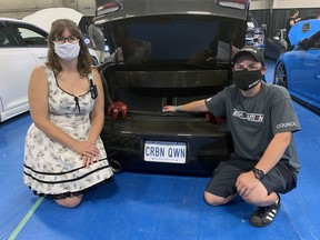 Kristine Hill (left), organizer of the Summer Showdown Car Show in Simcoe, with Alysha Kotlan, of Hamilton, one of 100 people to participate in this year's event. This was the 13th year for the event and organizers decided to go ahead with the show when the government changed COVID-19 public safety guidelines.