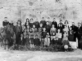 In 1902, the students, teacher, school trustees and horse at S. S. Number 6 Onondaga School posed in their Sunday best for their annual school photo. On the horse, which belonged to the teacher, was Harris Featherston who was the youngest student in the school. The map of Canada has been placed on the wall and the globe is in the bottom right corner.