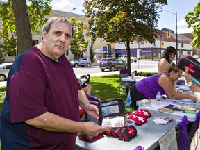 Randy Roberts of the Brantford Substance Users Network shows a naloxone kit the group was giving away during an Overdose Awareness Day event on Monday at Victoria Park in downtown Brantford.