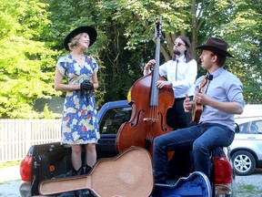Husband and wife Pat and Megan Whalen along with double bass player Fil Stasiak, are providing some live entertainment through their Tailgate Tour to bring some entertainment to local residents during the COVID19 pandemic. They are seen here during their first performance of the tour in Chatham, Ont. on Saturday August 8, 2020. (Ellwood Shreve/Chatham Daily News)