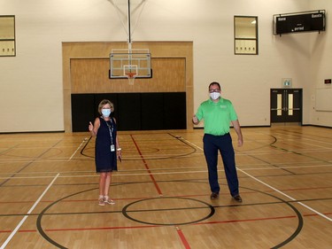 St. Clair Catholic District School Board director of education Deb Crawford shows Chatham-Kent Mayor Darrin Canniff the gymnasium during a tour of the new St. Angela Merici Catholic elementary school in Chatham on Thursday August 27, 2020. Ellwood Shreve/Chatham Daily News/Postmedia Network