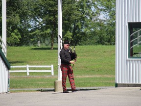 A lone piper, near an entrance to the infield at the Kenyon Agricultural Society Fairgrounds. Photo on Saturday, August 1, 2020, in Maxville, Ont. Todd Hambleton/Cornwall Standard-Freeholder/Postmedia Network