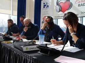 Volunteers Jeremy Gowsell, left, Coun. Todd Bennett, Dale McSween, Christine Lapensee, and Jolene Soares take pledges over the phone at the Corus Caring Hearts Radiothon on Thursday April 4, 2019. Alan S. Hale