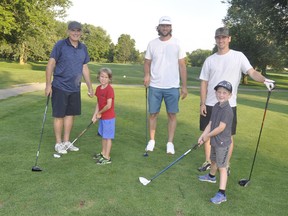 Family golf has been a popular thing at the Mitchell Golf & Country Club this summer, and the Elligsen brothers have taken advantage of the time to play three holes with their six-year-old sons a few times this year. Above, Tyler Elligsen and son Kayden (right), along with Kayden's grandfather Jay Kirktown (left), prepare to tee off with Nick Elligsen and his son Beckett. ANDY BADER/MITCHELL ADVOCATE