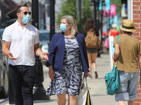 NDP Leader Andrea Horwath and Kingston and the Islands MPP Ian Arthur in downtown Kingston on Tuesday. (Steph Crosier/The Whig-Standard)