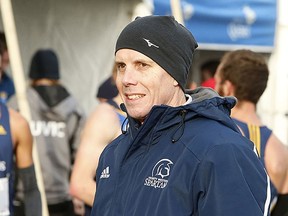 New Queen's Gaels cross-country and distance track coach Mark Bomba coaching the Trinity Western Spartans in 2016. (Supplied Photo)