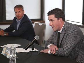 Paul McFarland, right, with Kingston Frontenacs president and governor Doug Springer, was introduced to the media at the Delta Kingston Waterfront as the Frontenacs general manager and coach on Tuesday. (Ian MacAlpine/The Whig-Standard)