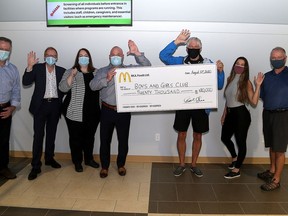 Staff members of the McDonald franchises in Kingston and Gananoque present a cheque for $20,000 to the  Boys and Girls Club of Kingston staff to help maintain their after school program  on Thursday August 27, 2020. From left John Mundell, Greg Dye, Mary Howlett and Todd Shea, all from McDonalds with former board chair of the club Peter Kingston and staff members Amanda Guarino and Harold Parsons.
