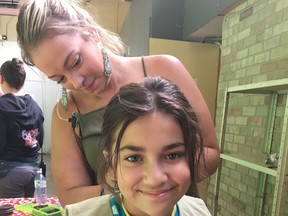 Liz Roelands is pictured working on actress Michela Luci's hair for the show Dino Dana. Roelands recently won a Daytime Emmy for her work on the kids' television program. (Submitted)