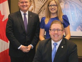 New federal Conservative party leader Erin O'Toole (left) poses in this file photo with friend Perth-Wellington MPP John Nater, of Mitchell, and John's wife Justine in Ottawa. O'Toole replaced Andrew Scheer after the election Aug. 23-24, and named Nater shadow minister for rural economic development on Sept. 8. SUBMITTED