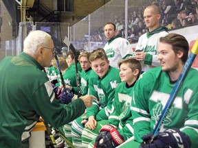 Former West Ferris Intermediate and Secondary School teacher and coach Peter Randle speaks with members of the Trojans hockey team in 2019, when he was recognized for bringing the East-West Game to North Bay. Randle died Saturday at age 83.
Nugget File Photo