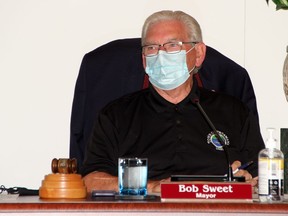Petawawa Mayor Bob Sweet presides over the first in-person council meeting for the town in 4 1/2 months, fully equipped with his mask and sanitizer. After months of holding special council meetings virtually over Zoom, council met in-person at the town hall Aug. 4 and it will resume it's regular Monday meeting schedule Aug. 10.