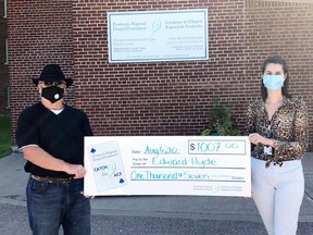 Edward Hyde, left, Week 3 of the Pembroke Regional Hospital Foundation's Catch the Ace draw, accepts his cheqhe for $1,007 from PRHF donor relations co-ordinator Hazel Smith. The draw was held Aug. 4. Draws will take place Tuesdays until the Ace of Spaces is revealed. Submitted photo