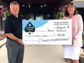 Dean Sauriol receives his Catch the Ace winnings from Marianhill CEO Linda Tracey. Submitted photo