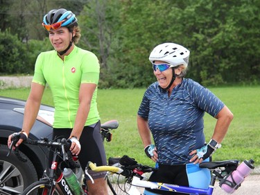 Even after 216 kilometres and over 10 hours on a bike, Marianne Carlyle and her son Cameron Carlyle-Locke can't help but smile as they are greeted by staff at the Renfrew County Animal Centre in Pembroke on Tuesday, Aug. 25. The pair rode their bicycles from Brockville to Pembroke in support of the Ontario SPCA Sweat For Pets fundraiser. Anthony Dixon