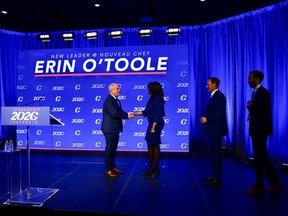 Newly elected Conservative leader Erin O'Toole shakes hands with his fellow candidates Leslyn Lewis, Peter MacKay and Derek Sloan after his winning speech following the Conservative Party of Canada 2020 Leadership Election in Ottawa.
REUTERS