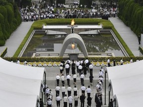 The Atomic Bomb Dome is seen from the venue holding a ceremony at the Hiroshima Peace Memorial Park in Hiroshima, western Japan, August 6, 2020, on the 75th anniversary of the atomic bombing of the city.