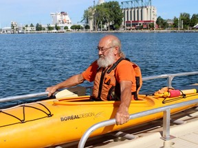 Sarnia resident Pete Williams boards the city's new accessible kayak and canoe launch on Thursday August 6, 2020 in Sarnia, Ont. (Terry Bridge/Sarnia Observer)