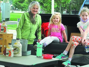 SYRUP AND POTATOES: Pauline Stadnyk with her granddaughter, Sloan, four, from Fair Isle Syrup Products, pose with fellow market vendor (and cohort for fun) Blake, seven, who sells potatos with her Grandpa Frank during the weekend at Algoma Farmers Market at Roberta Bondar Pavilion.  Vendors are available selling produce, preserves, jewellery and other goods every Saturday from 8 a.m. to 1 p.m. ALLANA PLAUNT/SAULT THIS WEEK