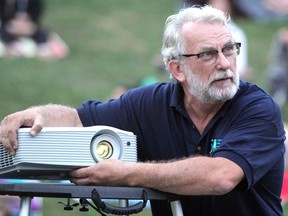 Bill MacPherson prepares for a screening at Summer Shadows at Bellevue Park in August 2018. BRIAN KELLY