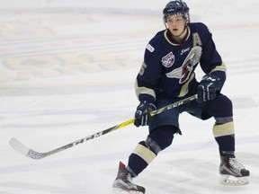 Spruce Grove Saints defenceman Ian Mitchell watches the play develop at the top of the offensive zone during AJHL action against the Fort McMurray Oil Barons at the Casman Centre in Fort McMurray, Alta. on Saturday December 3, 2016. The former Saint was recently signed to the Chicago Blackhawks.