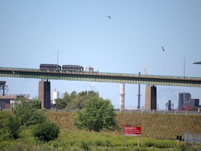 Northbound transport is seen on the International Bridge in Sault Ste. Marie. Algoma Steel is in the background on Thursday, July 30, 2020. (BRIAN KELLY/THE SAULT STAR/POSTMEDIA NETWORK)