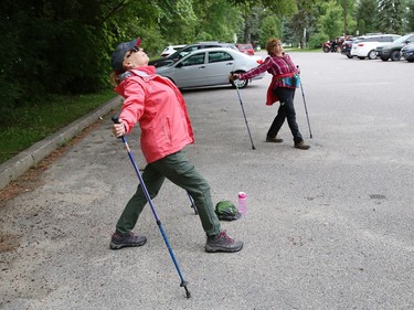 Urban polers Janie Wright, left, and Muffie McIntosh cool down while social distancing after a hike in Sudbury, Ont. on Tuesday August 4, 2020. A group of urban polers are taking part in the Sudbury Camino, a self-guided series of hiking adventures during the month of August. John Lappa/Sudbury Star/Postmedia Network