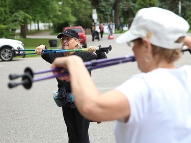 Urban polers Gisele Arlt, left, and Cecile Richardson cool down while social distancing after a hike in Sudbury, Ont. on Tuesday August 4, 2020. A group of urban polers are taking part in the Sudbury Camino, a self-guided series of hiking adventures during the month of August. John Lappa/Sudbury Star/Postmedia Network