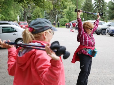 Urban polers Janie Wright, left, and Muffie McIntosh cool down while social distancing after a hike in Sudbury, Ont. on Tuesday August 4, 2020. A group of urban polers are taking part in the Sudbury Camino, a self-guided series of hiking adventures during the month of August. John Lappa/Sudbury Star/Postmedia Network