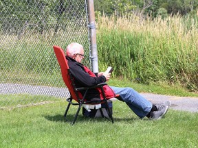 A man relaxes in solitude while reading a book.
John Lappa/Sudbury Star/Postmedia Network