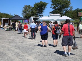 Customers line up for produce at the Sudbury Market in Sudbury, Ont. on Thursday August 6, 2020. The market is open Saturday from 8 a.m. to 2 p.m., and on Thursday from 2 p.m. to 6 p.m. at the York Street parking lot.