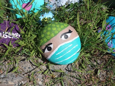 Rocks painted with faces and messages greet health care workers and visitors at Health Sciences North in Sudbury, Ont. on Thursday August 6, 2020. John Lappa/Sudbury Star/Postmedia Network