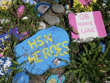 Rocks painted with faces and messages greet health care workers and visitors at Health Sciences North in Sudbury, Ont. on Thursday August 6, 2020. John Lappa/Sudbury Star/Postmedia Network