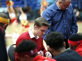 Sudbury Five head coach Logan Stutz speaks to players before a game against the Windsor Express at Sudbury Community Arena in Sudbury, Ontario on Saturday, December 1, 2018. He is preparing a basketball academy this fall for children as well as the next National Basketball League of Canada season. Ben Leeson/The Sudbury Star/Postmedia Network