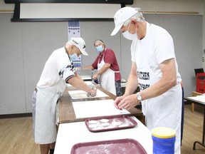 Ernie Bumka, left, Bill Zelenczuk and Terry Martyn prepare the dough for pyrohy at the Ukrainian Seniors' Centre in Sudbury, Ont. on Tuesday August 11, 2020. The centre has cancelled the Ukrainian Garlic Food Fest this year because of the COVID-19 pandemic, however, they are still offering curbside preorders for pick up on Aug. 23 when the festival was to be held. There is prepackaged pyrohy and cabbage rolls for $9 a dozen, and a hot luncheon featuring pyrohy, cabbage rolls and roasted chicken, balabushky and garllos. You must preorder the food items by Aug. 20 by calling 705-673-7404. Langside Farms and Big Ass Garlic will be in the parking lot at the centre on Aug. 22-23 to provide curbside preorders for pick up by appointment only. Call 705-673-7404 for more information on how to place an order with the vendors.