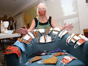 Sandra Sharko shows off a variety of face masks that are available for purchase at the Ukrainian Seniors' Centre in Sudbury, Ont. More than 500 masks, featuring mostly Ukrainian patterns, were made by Roma Shewciw of the Ukrainian centre. To place an order for curbside pick up, call 705-673-7404.