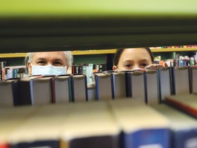 Carole Sanche and her granddaughter, Hope Newell, 10, search for books at the main branch of the Greater Sudbury Public Library on Mackenzie Street in Sudbury, Ont. in this file photo.