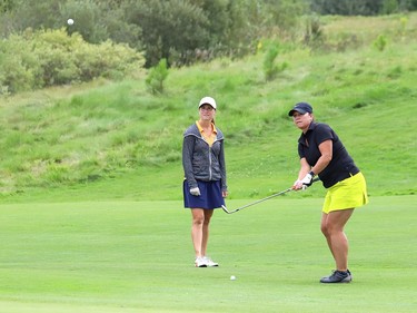 Jennie Gauthier, right, hits her ball onto the tenth green as Melanie Wing looks on during play at Timberwolf Golf Club's ladies' open two person scramble in Sudbury, Ont. on Tuesday August 18, 2020. The one-day tournament featured 21 teams. John Lappa/Sudbury Star/Postmedia Network